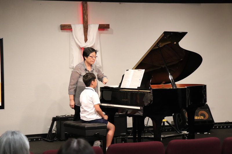 DVMTA Master Class teacher instructing student on piano