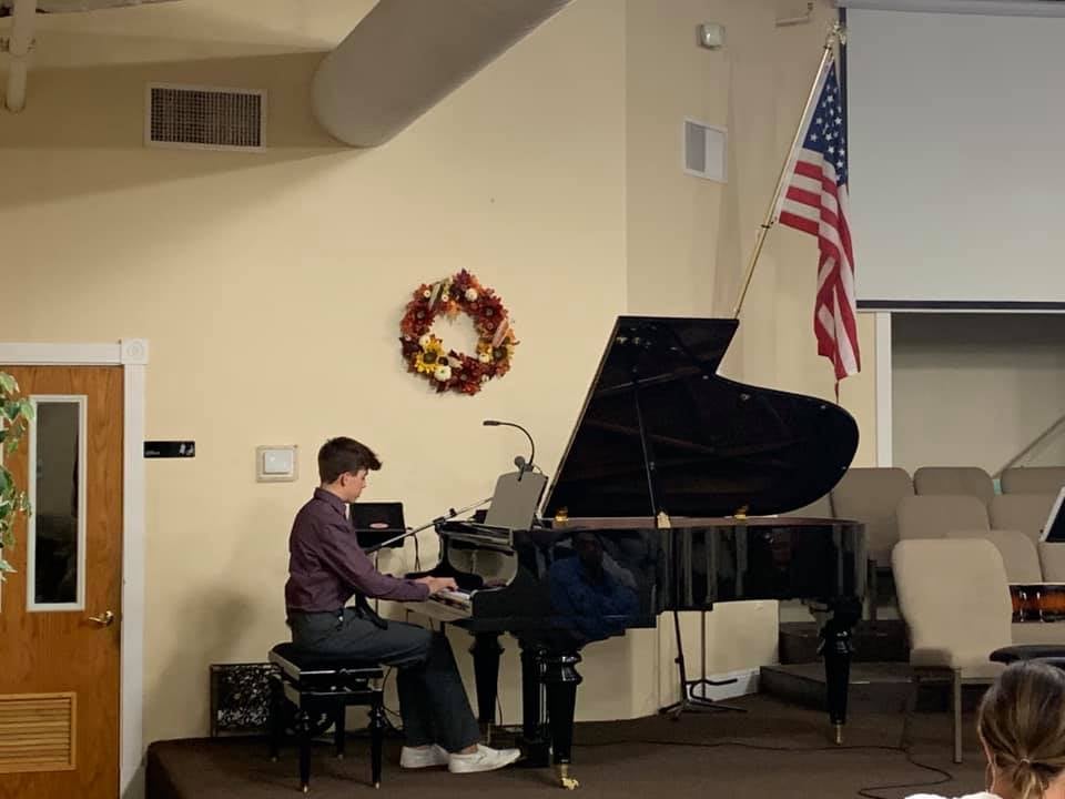 Teenage student performing at the Original Composition Festival