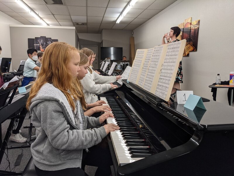 DVMTA Cavalcade students rehearsing together on pianos