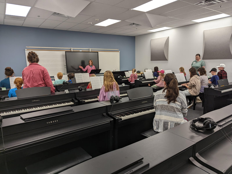 DVMTA piano students rehearse together in an ensemble