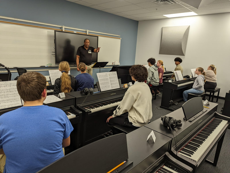 DVMTA piano students rehearse together in an ensemble