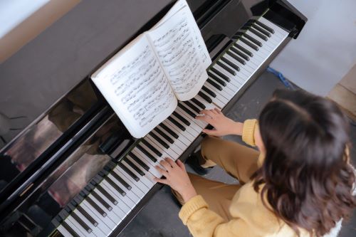 Achievement Day girl playing piano