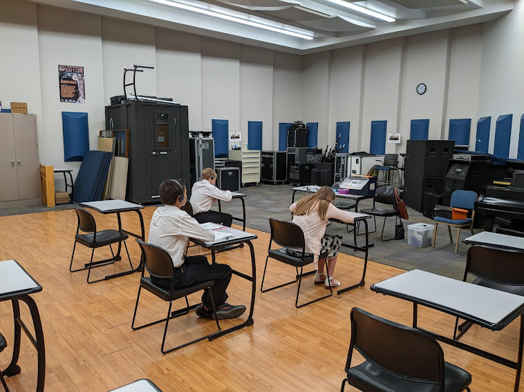 DVMTA Achievement Day students at desks for ear training testing